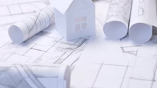Background with architectural drawings. Sheets with sketches of buildings.