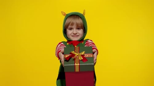 Smiling Child Elf Holding Christmas Presents