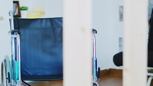 Empty Wheelchair Sitting in Home Interior