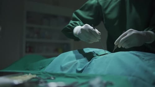 Medical Surgeons Team Performing Surgical Operation in Modern Operating medical Room at hospital.