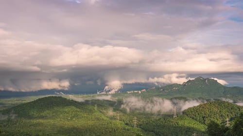 Rolling Hills Under Cloudy Sky Landscape
