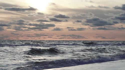 Beautiful Sunset At The Sea With Colorful Rays And Clouds
