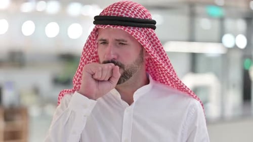 Bearded Man Coughing Indoors