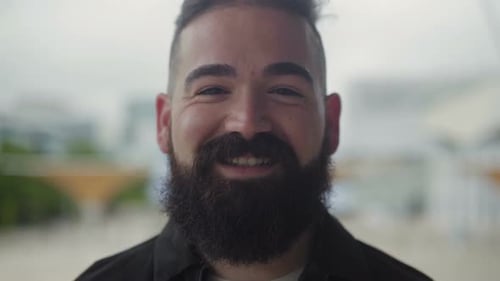 Bearded Man Smiling Happily in the City