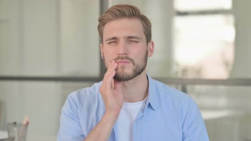 Young Man Experiencing Toothache