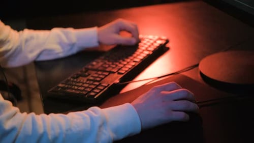 Close-up on a Hand on Computer Mouse Playing Video Games - eSports. Man Playing Pc Online