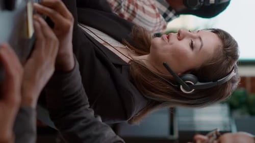 Vertical Video Young Woman Using Audio Headset and Computer at Call Center