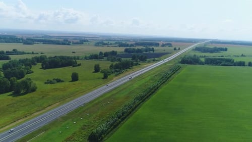 Aerial View Trucks Driving Along the Highway