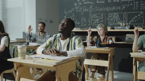 College Student Asking Questions during Lesson