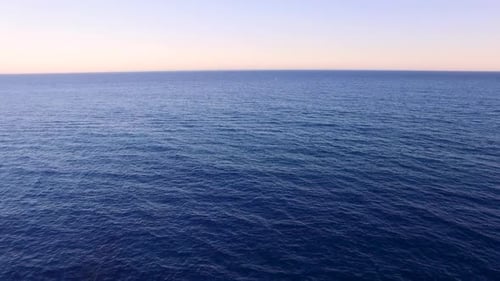 Sunset sea aerial view. Drone shot above ocean. Sea horizon. Mediterranean sea, paradise, tropical e