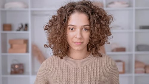 Smiling Young Adult Woman with Curly Hair Portrait