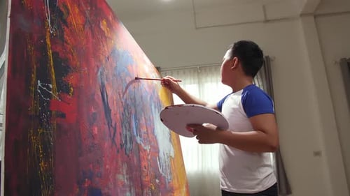 Child Painting on a Large Abstract Canvas