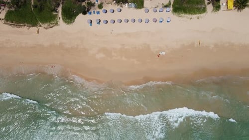 Aerial view of white sand beach and ocean wave