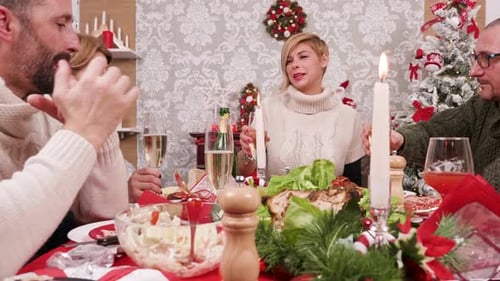 Family Cheers Champagne at Christmas Celebration