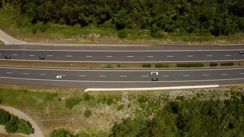 Traffic motion on a highway road in the mountains.
