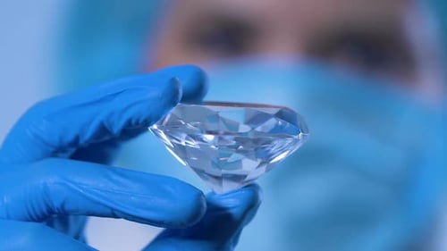 Close-Up of Diamond Held in Surgical Glove