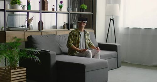 Man Enjoying Virtual Reality Experience on Couch