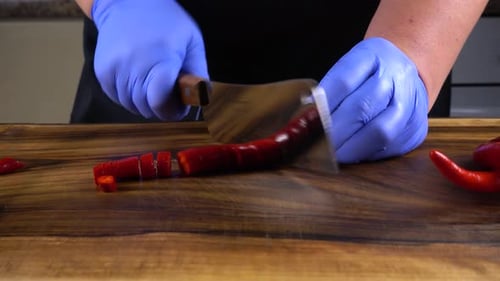 The Cook Cuts Chilli Pepper