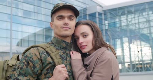 Loving Couple Embracing Outside Airport, Soldier Returning Home