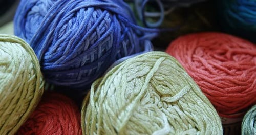 Bunches of different coloured woollen yarn 4k
