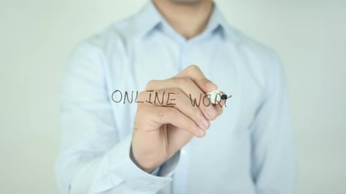 Man Writes Online Work on Clear Surface