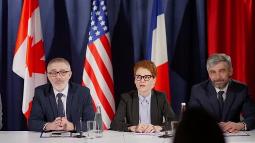 Panel of Adults at an International Press Conference