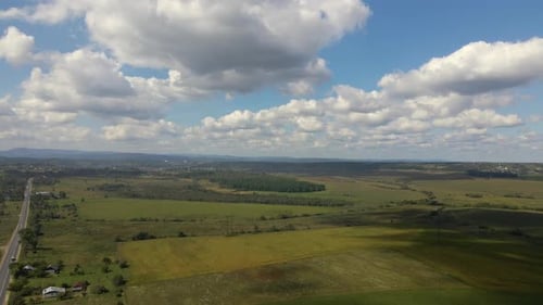 Aerial View From High Altitude of Earth Covered with White Puffy Cumulus Clouds