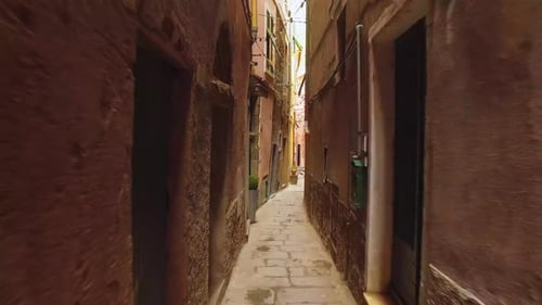 Walking Through an Ancient Narrow Street with Stone Road in Cinque Terre
