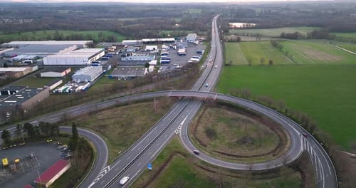 Aerial View of Highway Road Intersection with Fast Moving Heavy Traffic