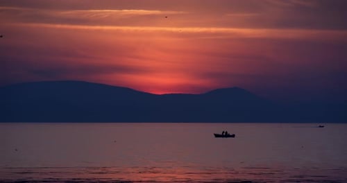 Fishermen On The Sea Sunset