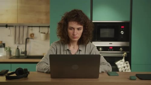 Young 20s Adult Student Bored Working on a Laptopp
