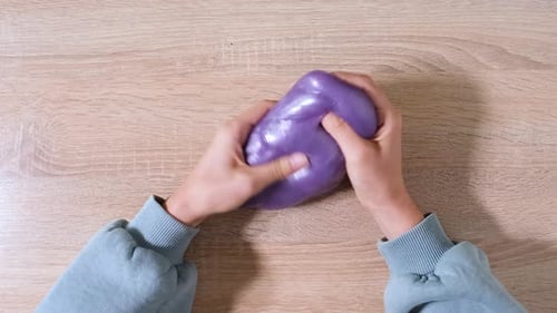 Playing with Slime Stretching the Gooey Substance for Fun and Stress Relief