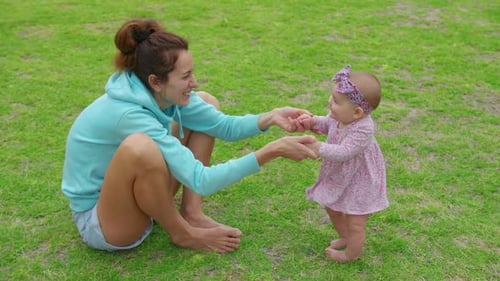 Happy Little Baby Girl Playing Together with Her Mother Outdoor in the Park Adorable Baby Lifestyle