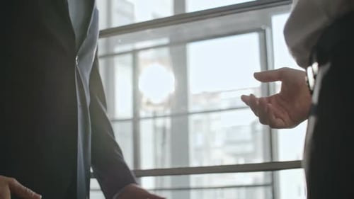 Businessmen Handshake in Modern Office Building