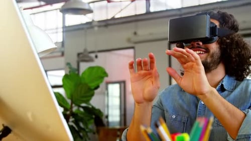 Man Using Virtual Reality Headset in Office