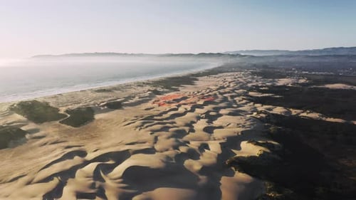 Aerial View of Dunes Meeting the Ocean Coastline