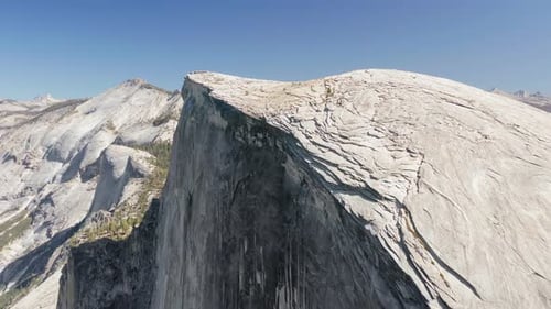 Half Dome Mountain Aerial Survey in Sunny Weather. Yosemite National Park, California, USA