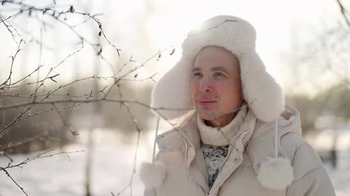 Walk in Nature in January Cold Day Handsome Smiling Man is Exploring Winter Forest in Sunny Weather