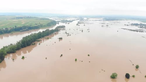 Aerial View River That Overflowed After Heavy Rains and Flooded Agricultural Fields
