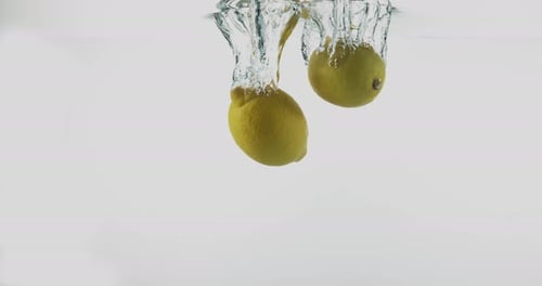 Lemons Splashing in Water, Close Up Shot