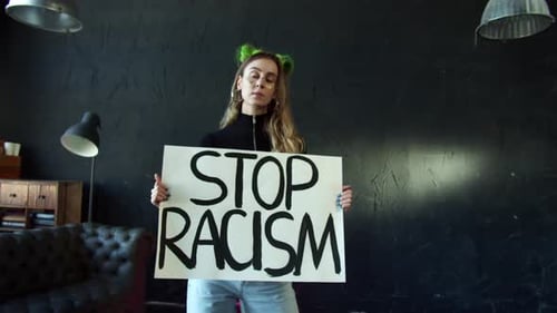 Woman Holding Stop Racism Sign