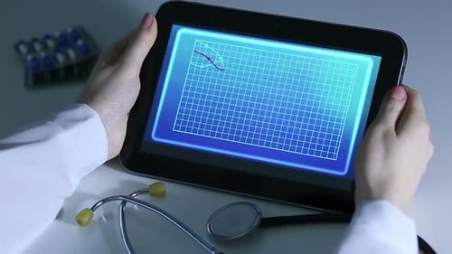 Doctor Hands Hold Tablet with Health Data Chart