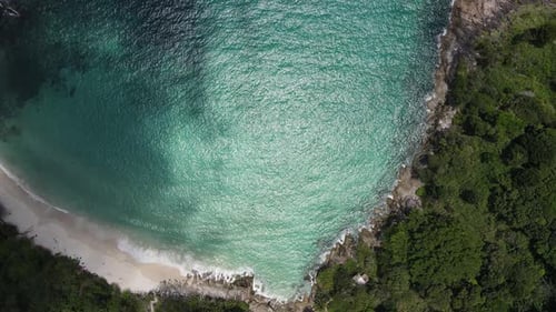Aerial view of white sand beach and ocean wave