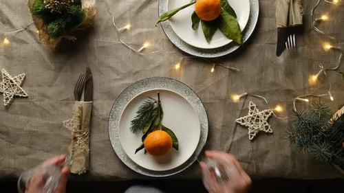 Festive Holiday Table Setting with Tangerines and Decor