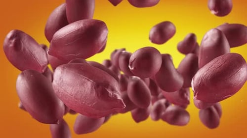 Red Peanuts Floating in Front of Yellow Background