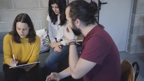 Team Collaborating on Tablet in Modern Workplace