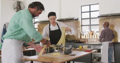 Chefs making pasta together