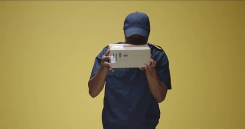 Man in Uniform Receives a Package and Disapproves