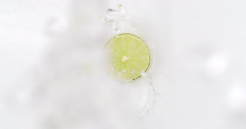 Lime Slice Gets Refreshing Water Splash on White
