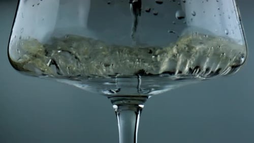 White Wine Filling Glass Closeup